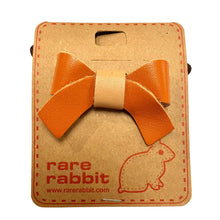 Load image into Gallery viewer, Stiff Leather Bow Hair Accessory in Orange By Rare Rabbit
