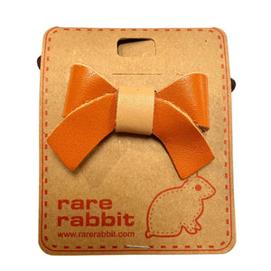 Stiff Leather Bow Hair Accessory in Orange By Rare Rabbit